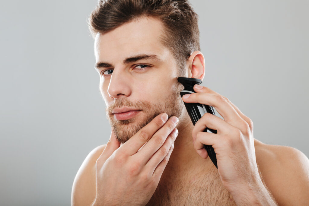 attractive masculine male being undressed at home having skincar